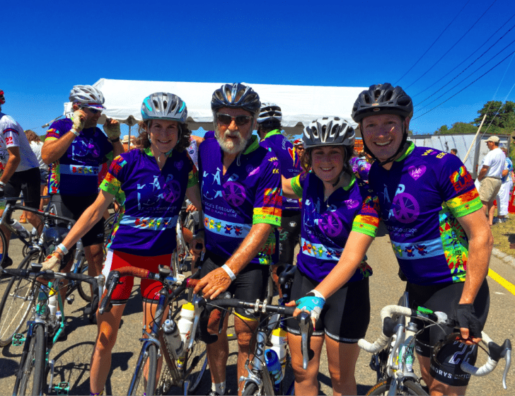 Four PMC participants with their bikes