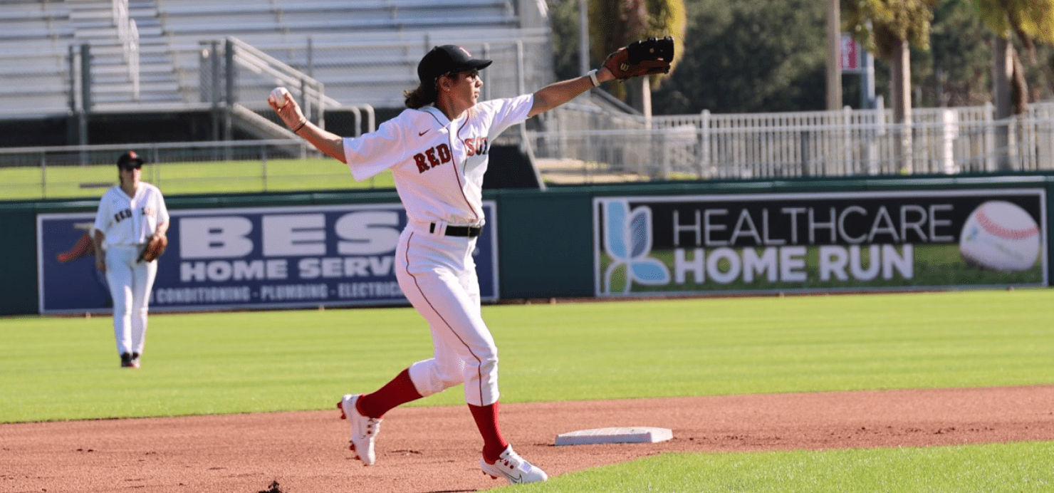 Baseball player throws a ball at Fantasy Camp