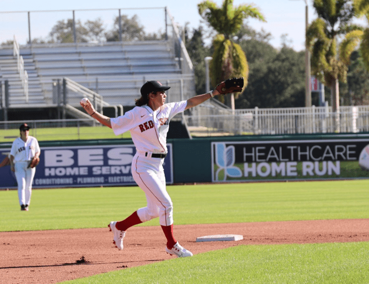 Baseball player throws a ball at Fantasy Camp